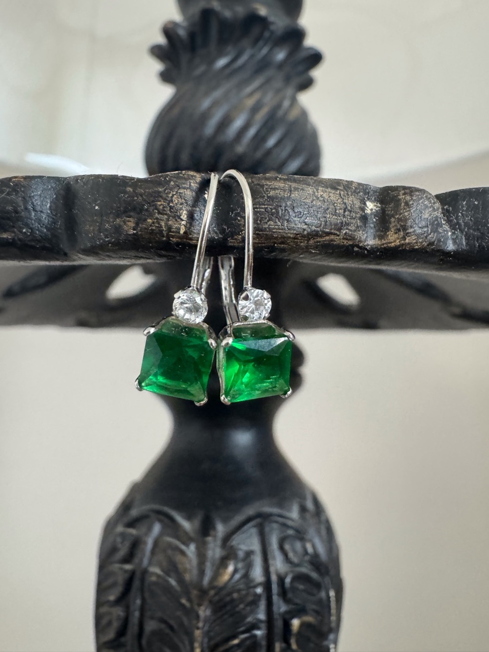 Emerald and diamond earrings.